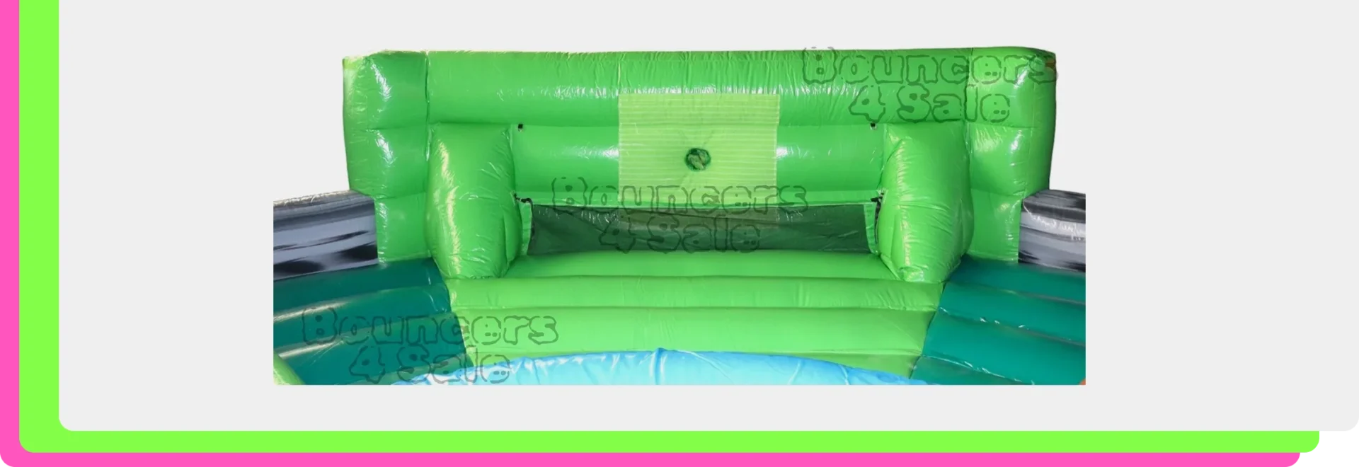 A green inflatable couch with two pillows.