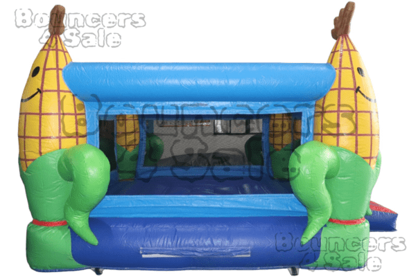 A blue and green inflatable bouncer with corn.