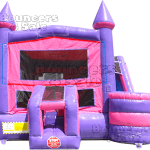 A pink and purple inflatable castle with slide.