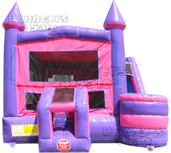 A pink and purple inflatable castle with slide.