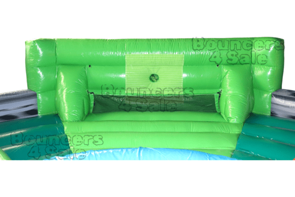 A green couch in the middle of an inflatable pool.