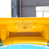 A yellow and blue inflatable slide in the sun.