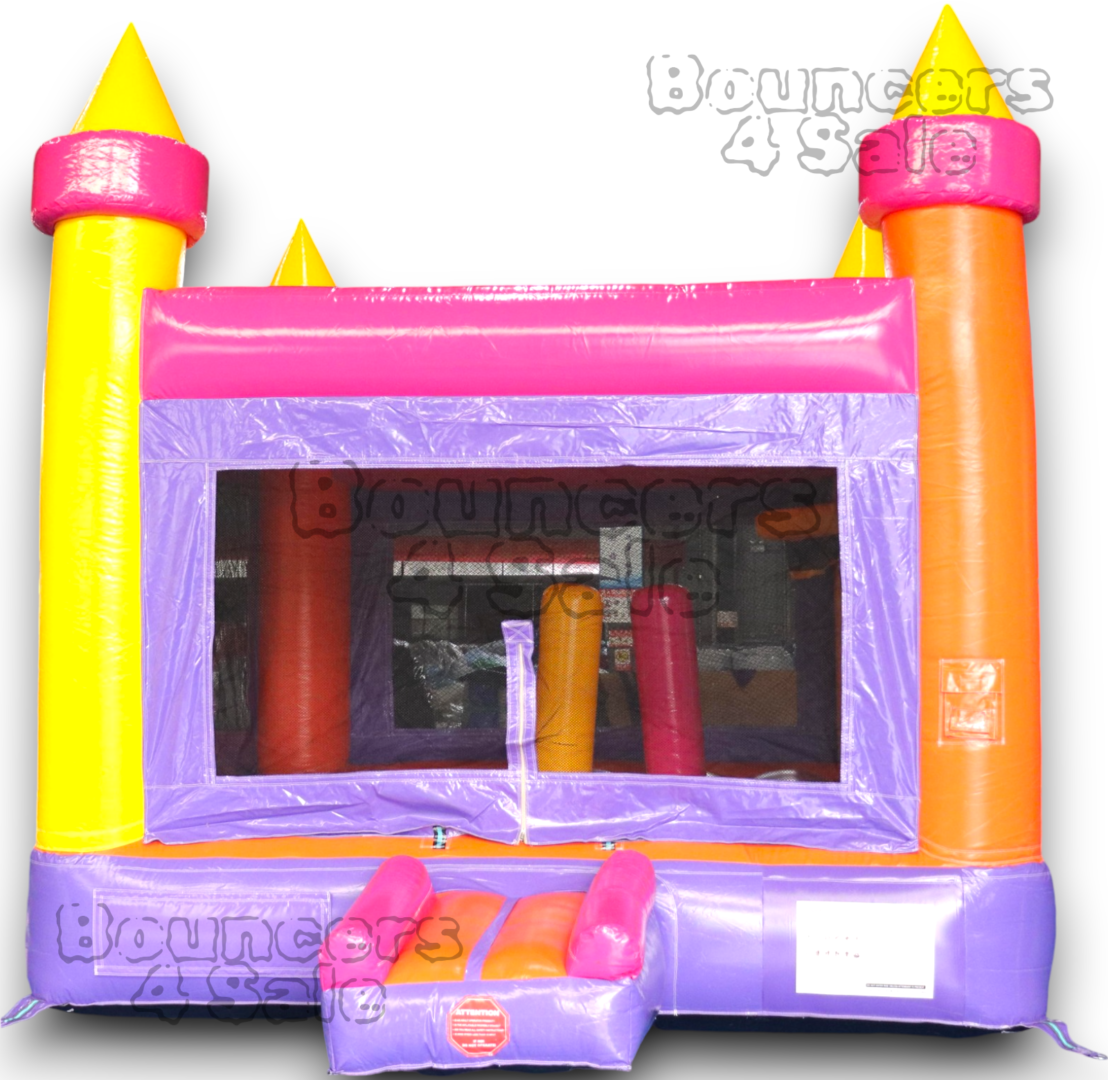 A pink and yellow inflatable castle with a slide.