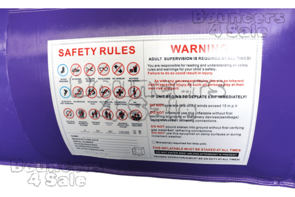 A safety rules sign is displayed on the side of a purple vehicle.