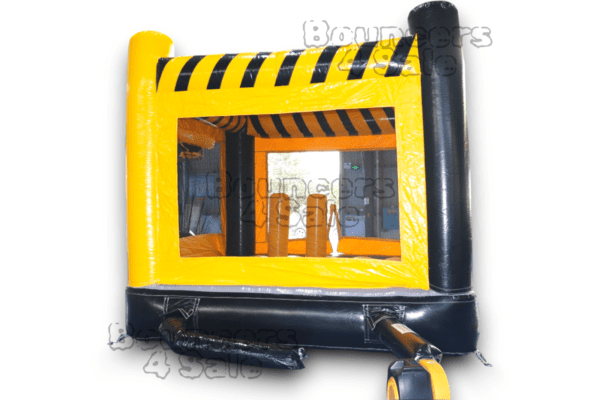 A black and yellow inflatable bounce house with a mirror.