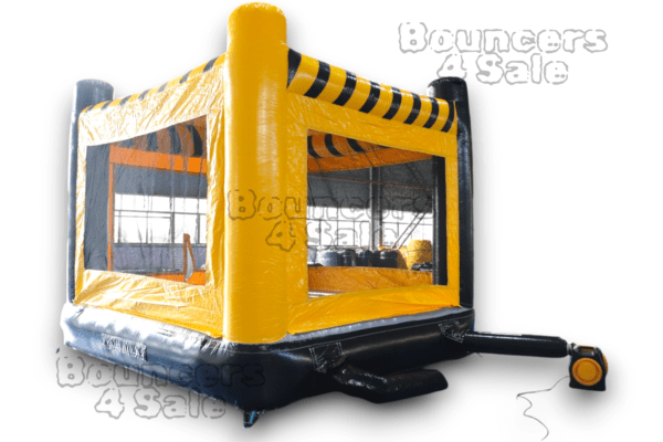 A black and yellow inflatable bounce house.