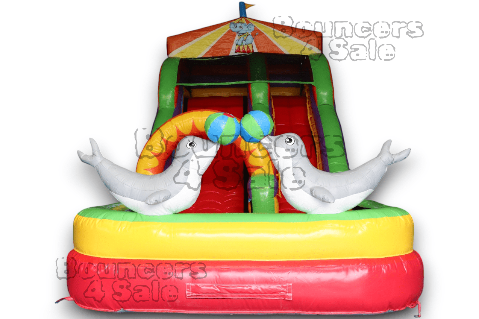 A inflatable slide with two white seals on it.