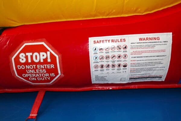 A red and yellow inflatable with instructions on safety.