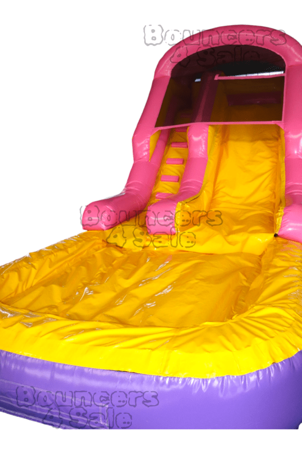 A pink and yellow inflatable slide with water.