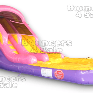 A pink and yellow inflatable slide on top of purple ground.