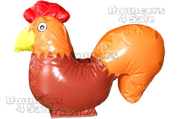 A large inflatable chicken is sitting in the air.