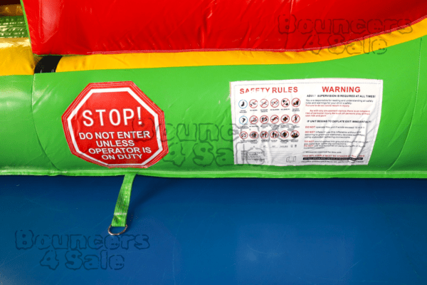 A close up of the stop sign on an inflatable slide.