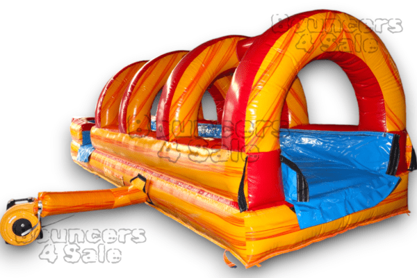 A long inflatable slide with red and yellow arches.