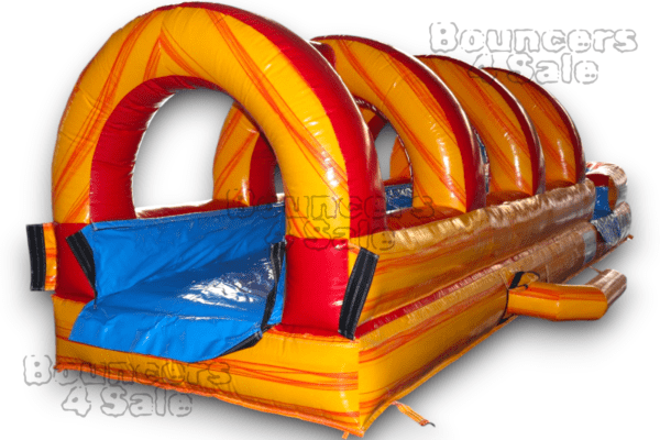 A yellow and red inflatable slide with blue seats.