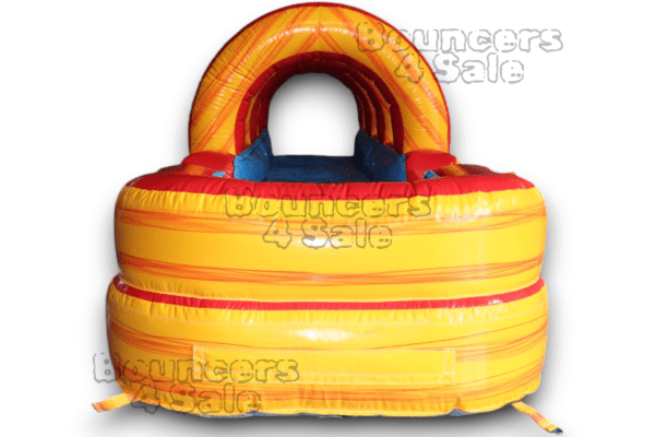 A yellow and red inflatable bouncer with a blue handle.