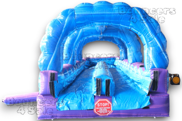 A blue inflatable slide with a train on it.