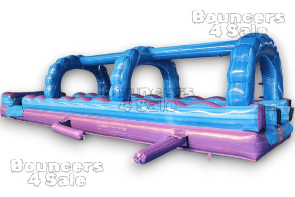 A purple and blue inflatable water slide.