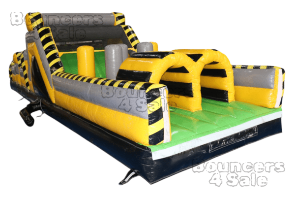 A inflatable obstacle course with obstacles and yellow stripes.