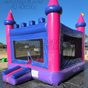 A pink and purple castle bounce house.