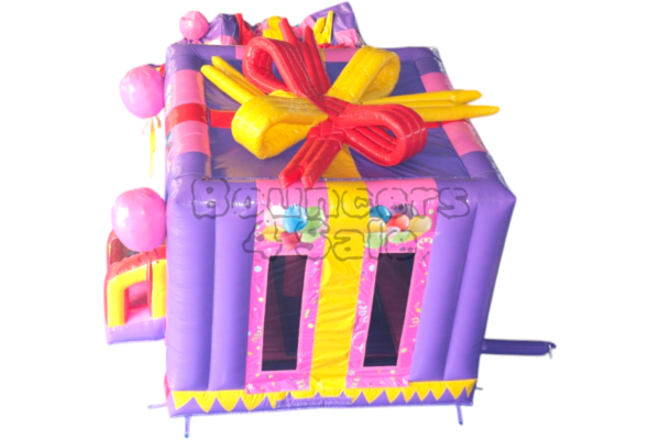 A purple and yellow inflatable present with balloons.