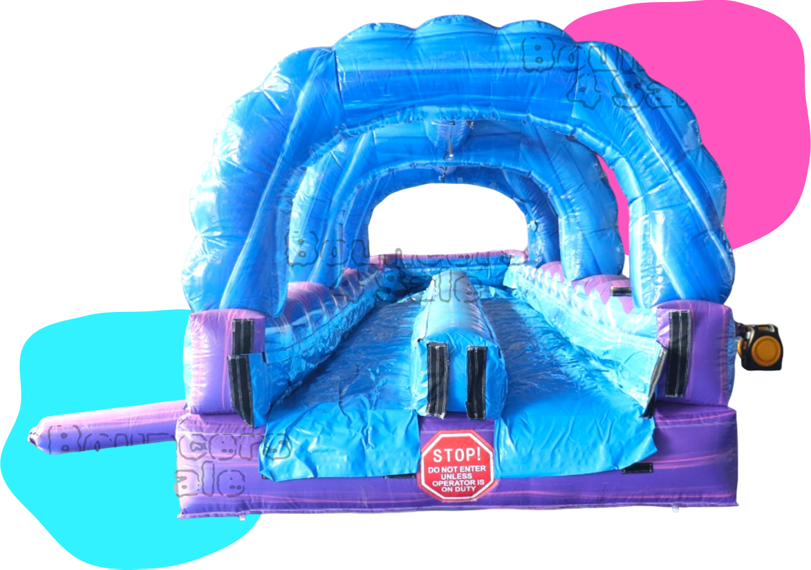 A purple and blue inflatable slide with obstacles.